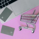 Silver Shopping Cart on Pink Surface